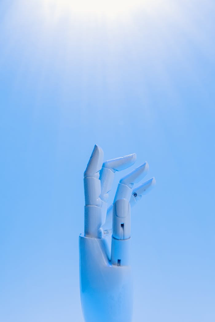 Robot's Hand on Blue Background